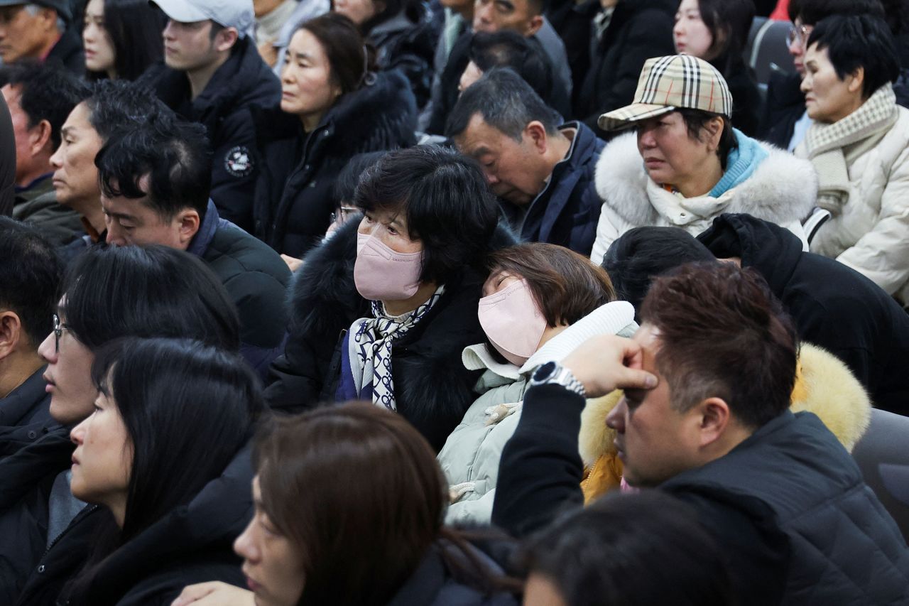 Relatives of passengers of the crashed aircraft gather at Muan International Airport on December 29.