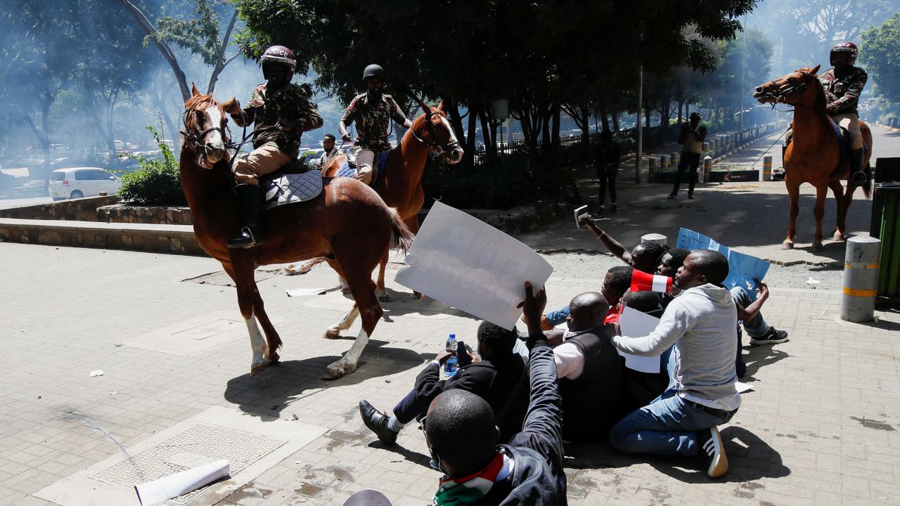 Riot police lob tear gas canisters as they attempt to disperse protesters demonstrating against what they say is a wave of unexplained abductions of government critics, along the Aga Khan walk in downtown Nairobi, Kenya December 30, 2024.