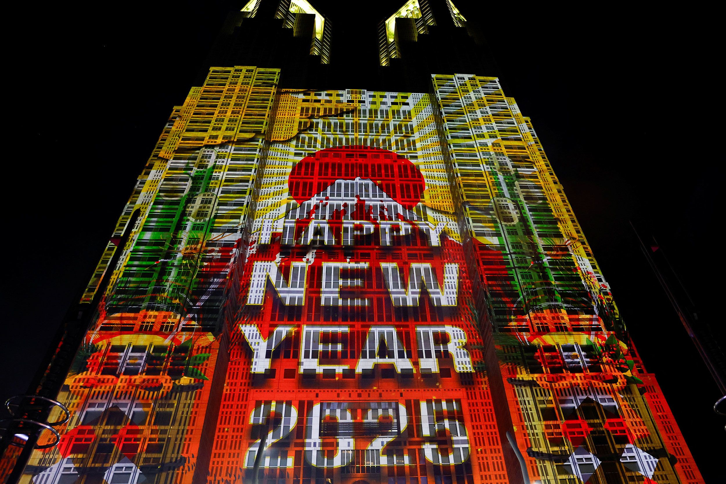 A New Year's message is projected onto the surface of the Tokyo Metropolitan Government Building.