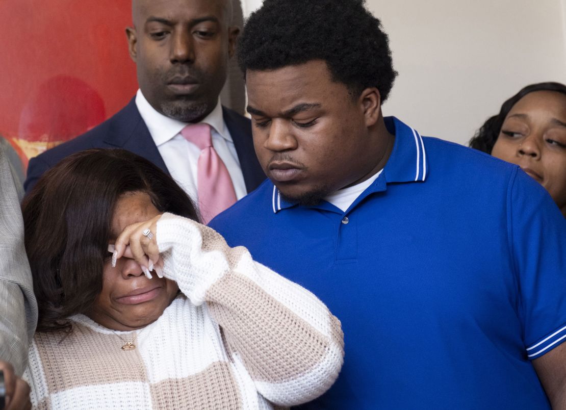 Jessica Ross and Treveon Isaiah Taylor Sr. react during a news conference in Atlanta on Wednesday, February 7, 2024.