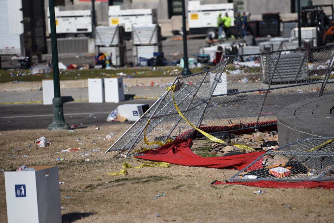 Crime scene tape hangs from a fence following the prior day's shooting at Kansas City's Union Station.