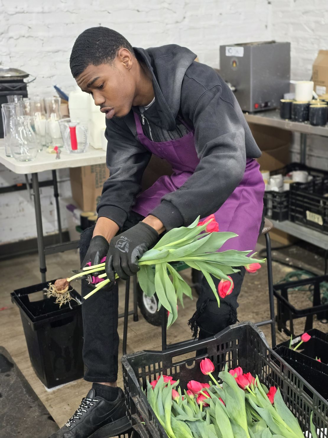 Rashod Little creates a bouquet at Southside Blooms.