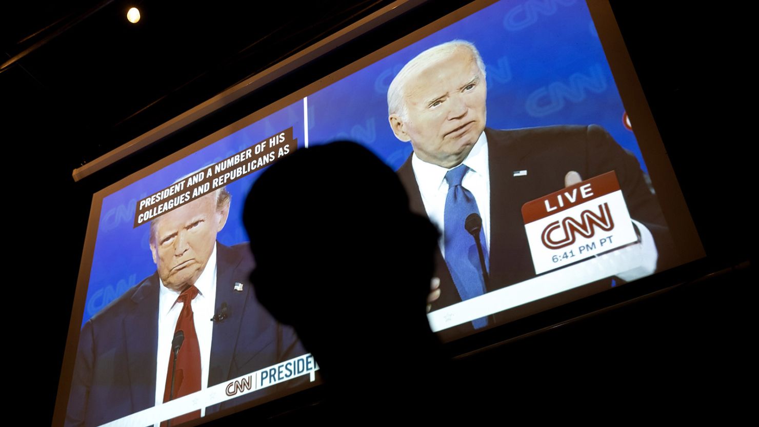 A man watches the CNN presidential debate between Donald Trump and Joe Biden at a watch party at Union Pub in Washington, DC, on June 27, 2024.