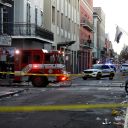 A fire truck and a police vehicle operate near the site where people were killed by a man driving a truck in an attack during New Year's celebrations, in New Orleans, Louisiana, U.S. January 1, 2025.  REUTERS/Octavio Jones