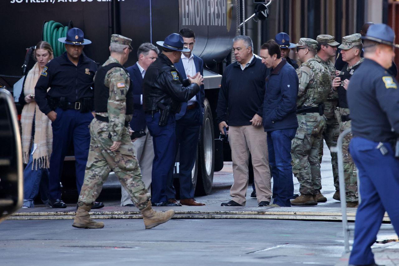 Gov. Jeff Landry speaks with members of law enforcement at the site where people were run over by a truck in the day before in New Orleans, Louisiana, on January 2.