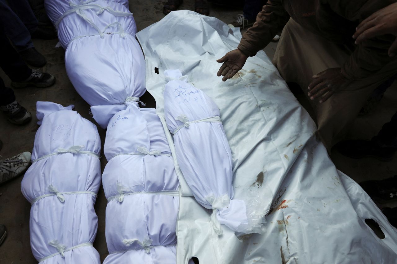 People attend the funeral of Palestinians killed by Israeli strikes at Al-Aqsa Martyrs Hospital in Deir al-Balah, Gaza, on January 3. Human rights organizations, such as Amnesty International in December, have concluded that Israel is committing genocide against Palestinians in Gaza.