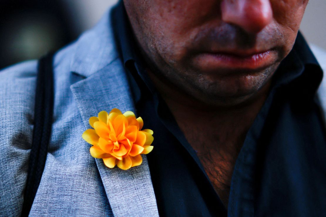 A man wears a symbol for the victims near a makeshift memorial at Bourbon Street after a US Army veteran drove his truck into the crowded French Quarter.