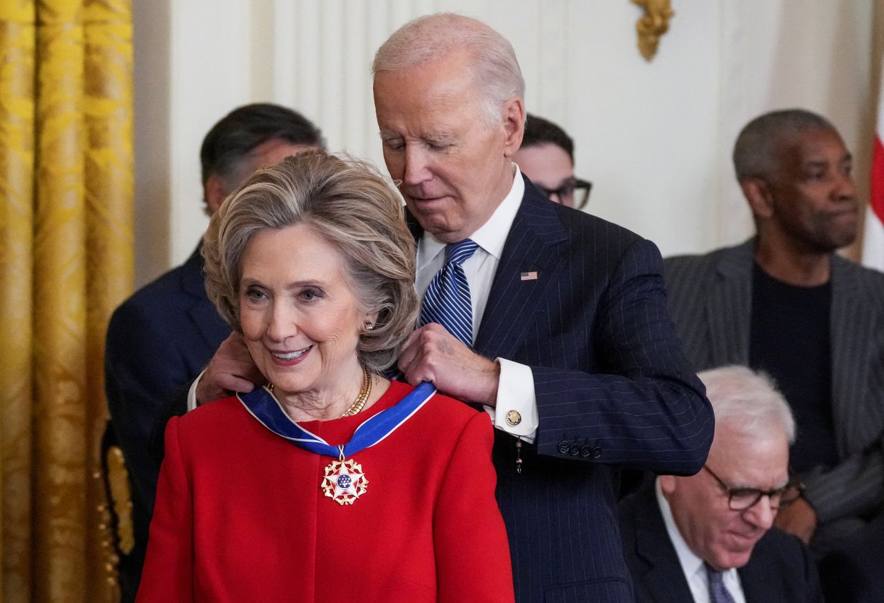 President Joe Biden presents the Presidential Medal of Freedom to Hillary Clinton during a ceremony at the White House, in Washington, DC on January 4.