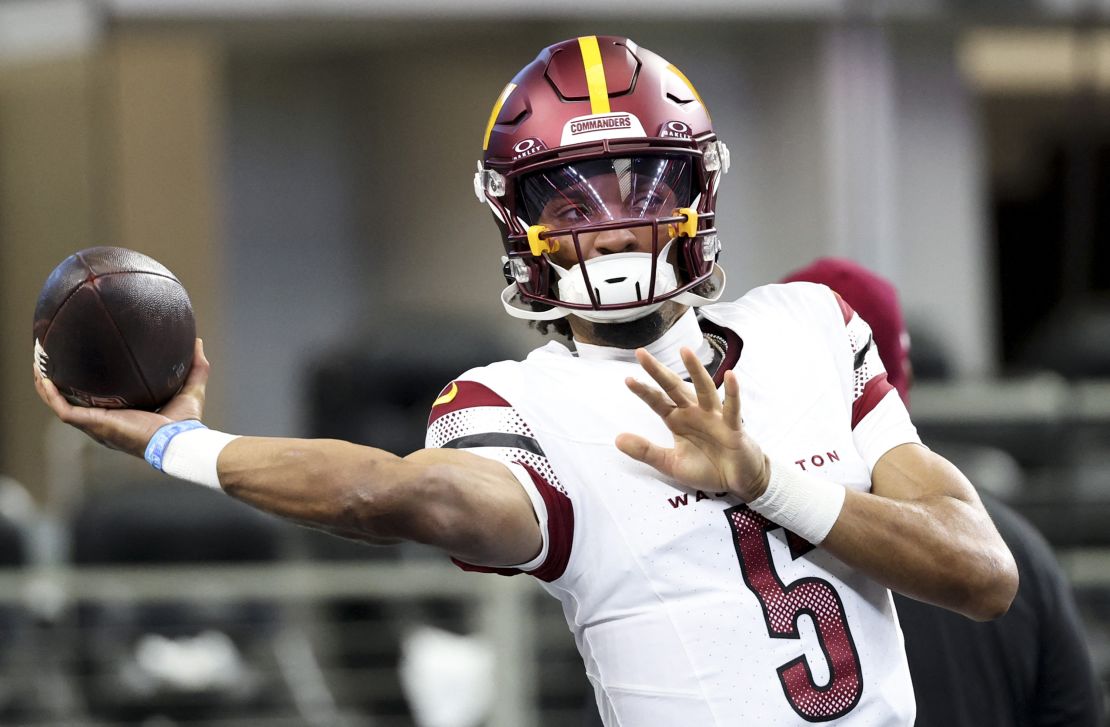 Jan 5, 2025; Arlington, Texas, USA; Washington Commanders quarterback Jayden Daniels (5) warms up before the game against the Dallas Cowboys at AT&T Stadium. Mandatory Credit: Kevin Jairaj-Imagn Images