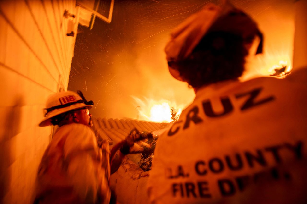 Firefighters battle the Palisades fire as it burns on the west side of Los Angeles, California, on January 8.