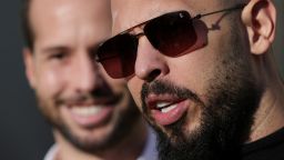 Andrew Tate, next to his brother Tristan Tate, talks to media representatives after exiting the Bucharest courthouse, in Bucharest, Romania, January 9, 2025. Inquam Photos/Octav Ganea via REUTERS ATTENTION EDITORS - THIS IMAGE WAS PROVIDED BY A THIRD PARTY. ROMANIA OUT. NO COMMERCIAL OR EDITORIAL SALES IN ROMANIA
