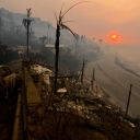 Sun rises over the Pacific Palisades neighborhood of west Los Angeles, in the aftermath of devastating wildfires in the Los Angeles area forcing people to evacuate, in California, U.S., January 9, 2025.