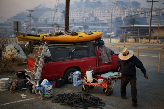 A man fetches water along the Pacific Coast Highway.