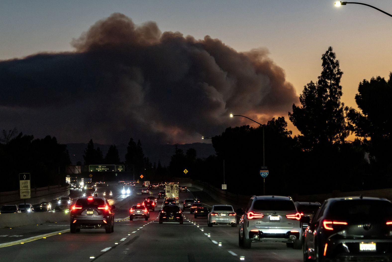 Smoke from the Palisades Fire rises over the hills near Santa Monica.