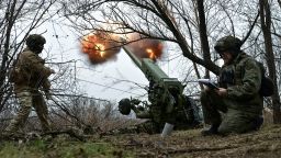 Servicemen fire a howitzer toward Russian troops in Ukraine's Zaporizhzhia region on January 11.