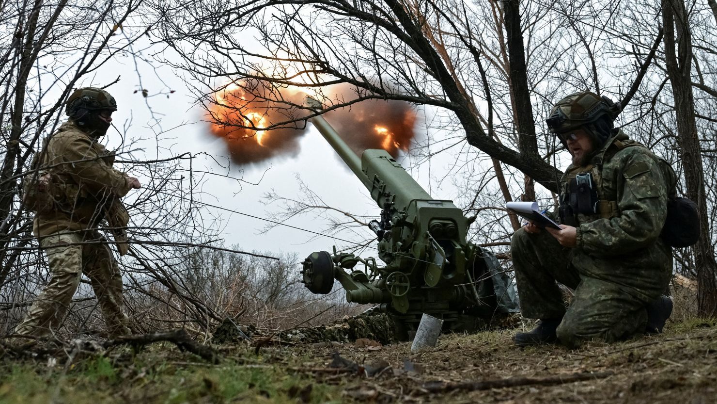 Servicemen fire a howitzer toward Russian troops in Ukraine's Zaporizhzhia region on January 11.