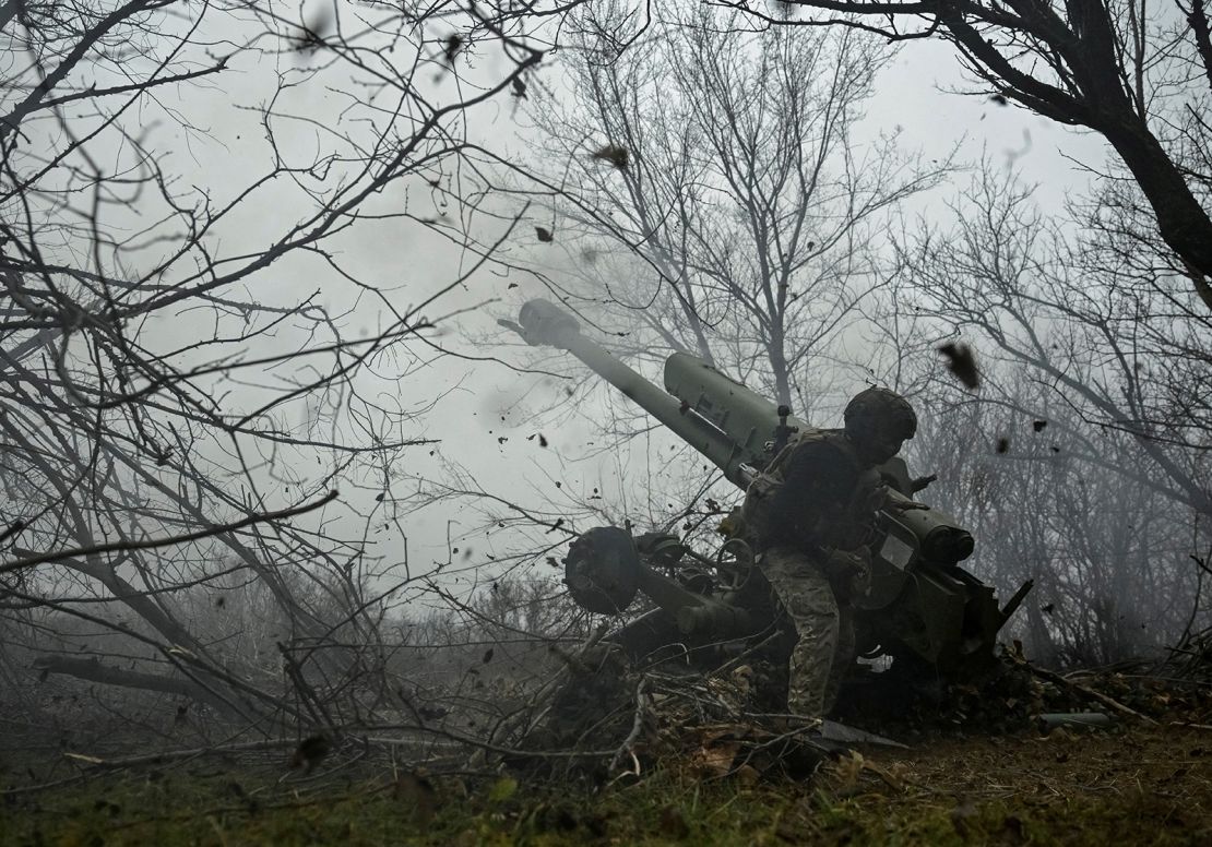 A serviceman of the artillery crew of Ukraine's special unit National Police fires a D-30 howitzer towards Russian troops in the Zaporizhzhia region on January 11.