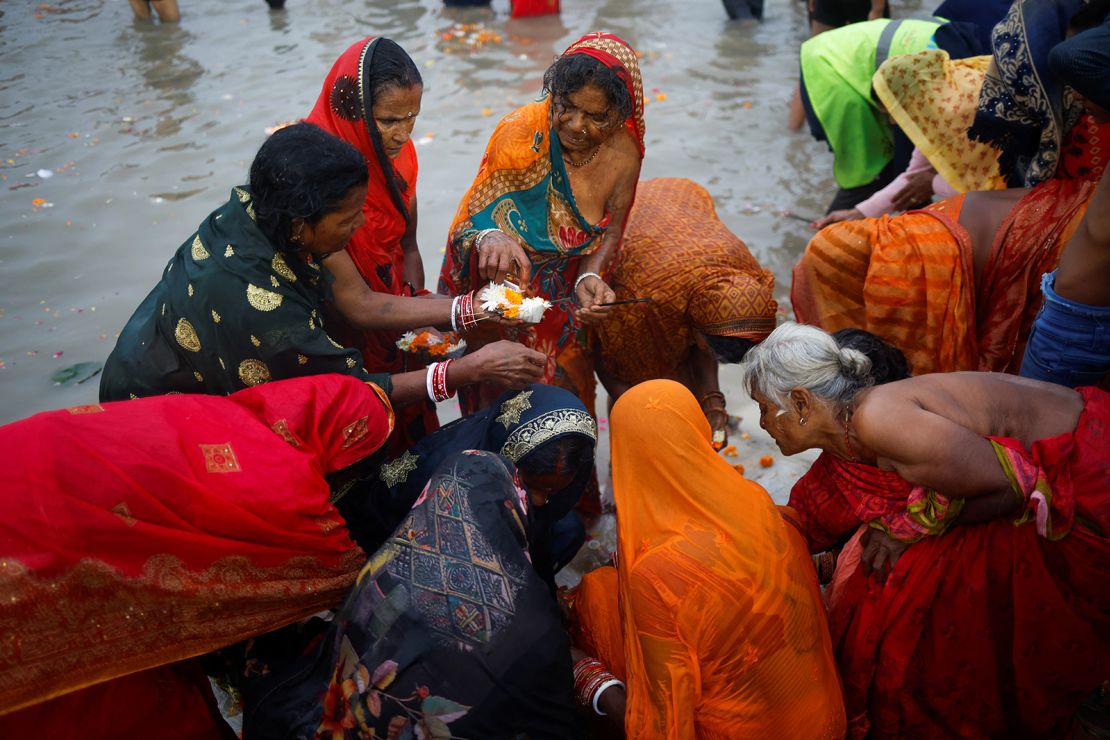 People offer prayers at Sangam, the confluence of the Ganges, Yamuna and Saraswati rivers, during the Maha Kumbh Mela Festival, in Prayagraj, India, on January 13, 2025.