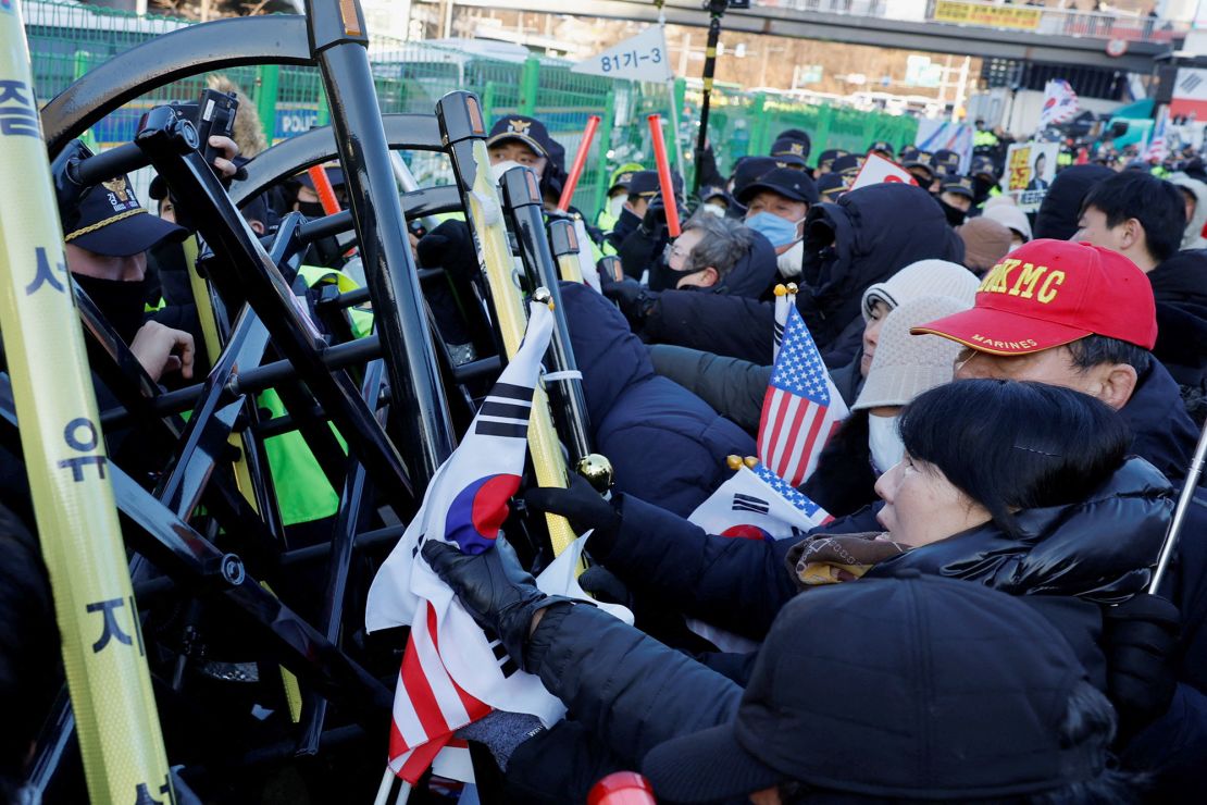 South Korean President Yoon Suk Yeol's supporters scuffle with police officers as authorities seek to execute an arrest warrant, in Seoul, South Korea, January 15, 2025.