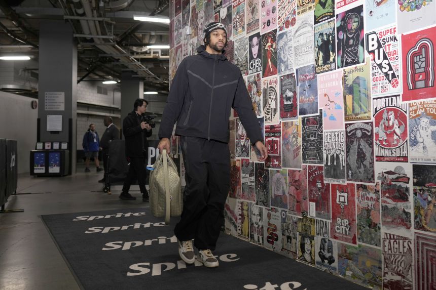 Tosan Evbuomwan arrives to the arena before an NBA game in Portland last season.
