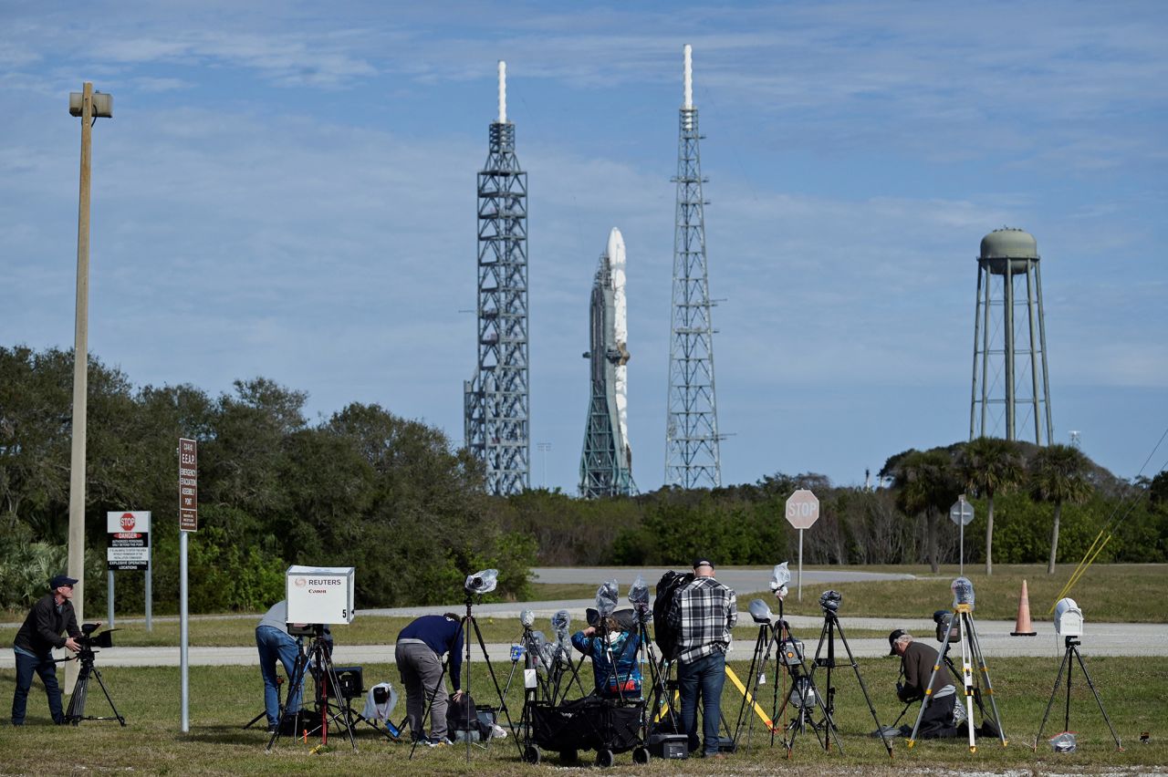 Photographers reset remote cameras for the inaugural launch of the Blue Origin New Glenn rocket at Kennedy Space Center in Cape Canaveral, Florida, on Wednesday.