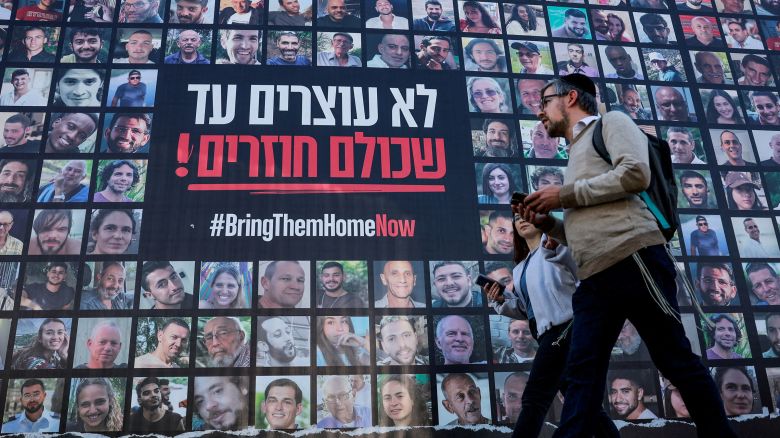 People walk past posters of hostages kidnapped during the deadly October 7, 2023, attack by Hamas in Jerusalem on January 16.