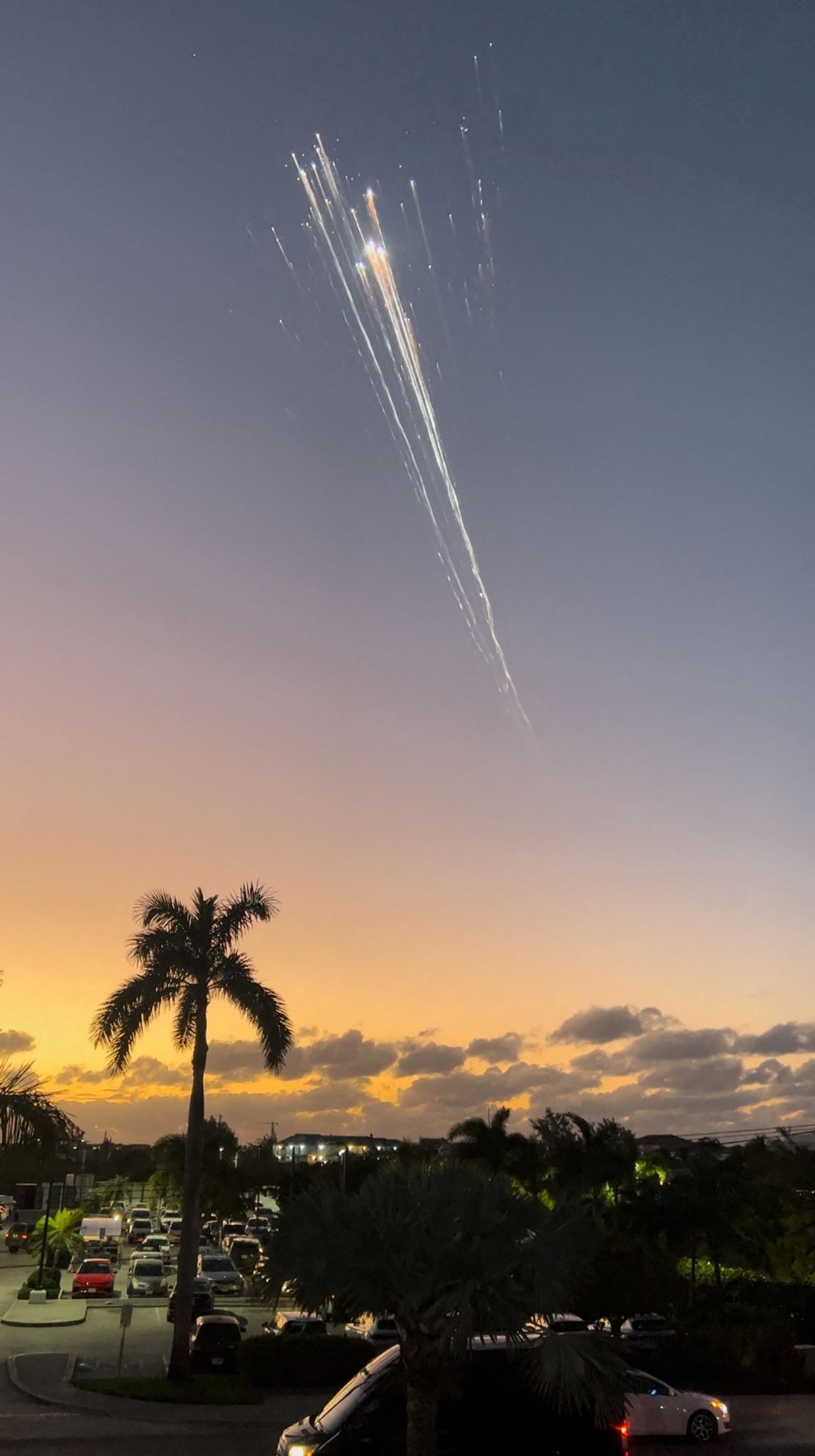 In this screengrab obtained from social media video, orange balls of light fly across the sky as debris from a SpaceX rocket launched in Texas was spotted over Turks and Caicos Islands on January 16.