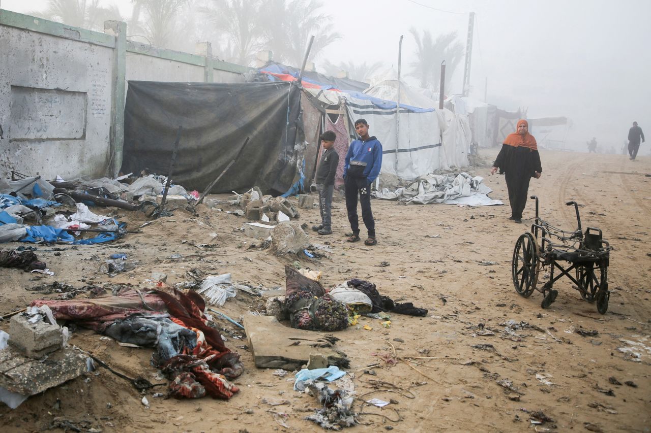 Palestinian boys stand near a damaged tent for displaced people, after an Israeli airstrike in Khan Younis, Gaza, on Friday.