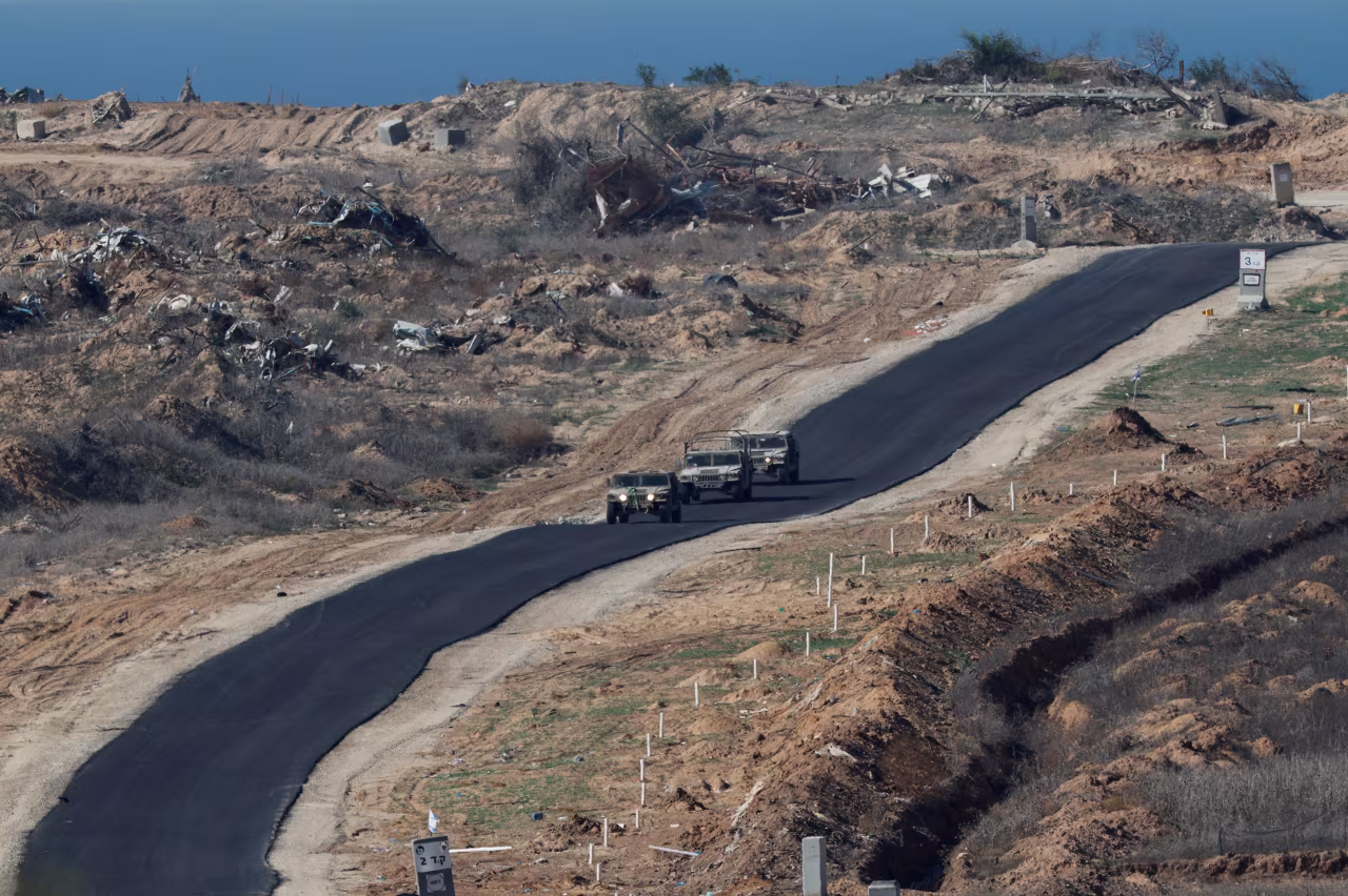 The Israeli military drives vehicles inside Gaza, as seen from southern Israel, on Saturday.