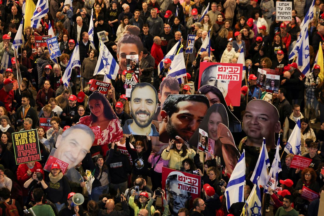 arafed image of a crowd of people with flags and pictures