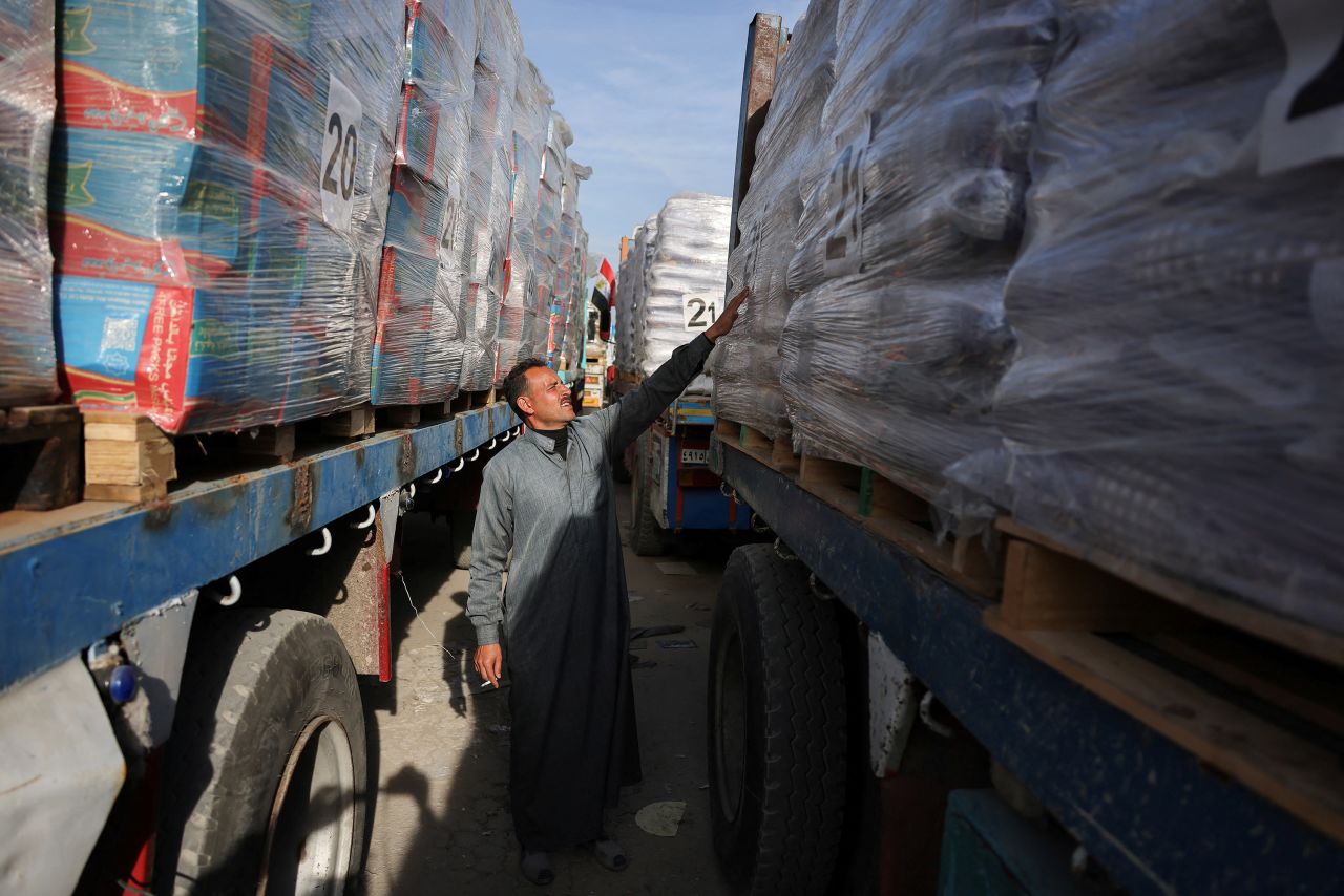 Trucks carrying aid wait to enter Gaza near the Rafah border crossing on Sunday.