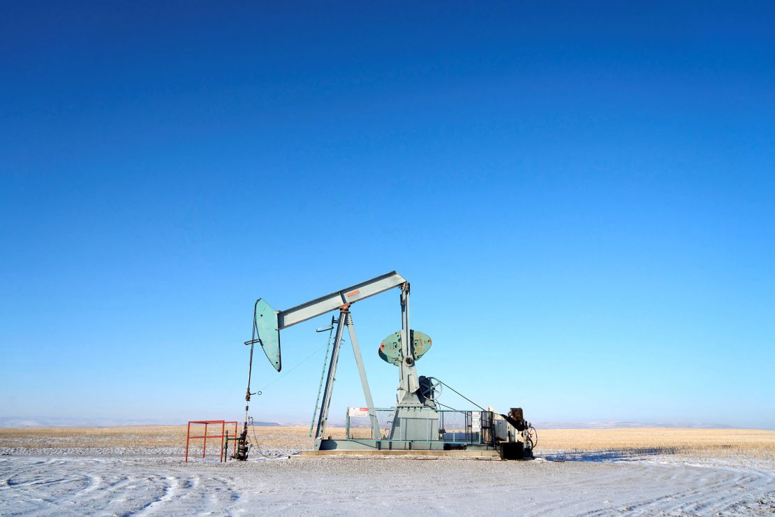 An oil pump ⁤jack works on the prairies near Claresholm, Alberta, Canada, ​on January 18.