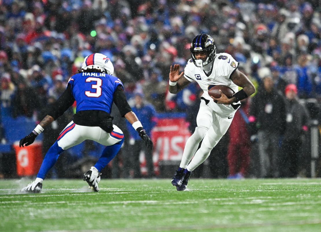 Baltimore Ravens quarterback Lamar Jackson runs the ball against Buffalo Bills safety Damar Hamlin (3) during the second quarter.