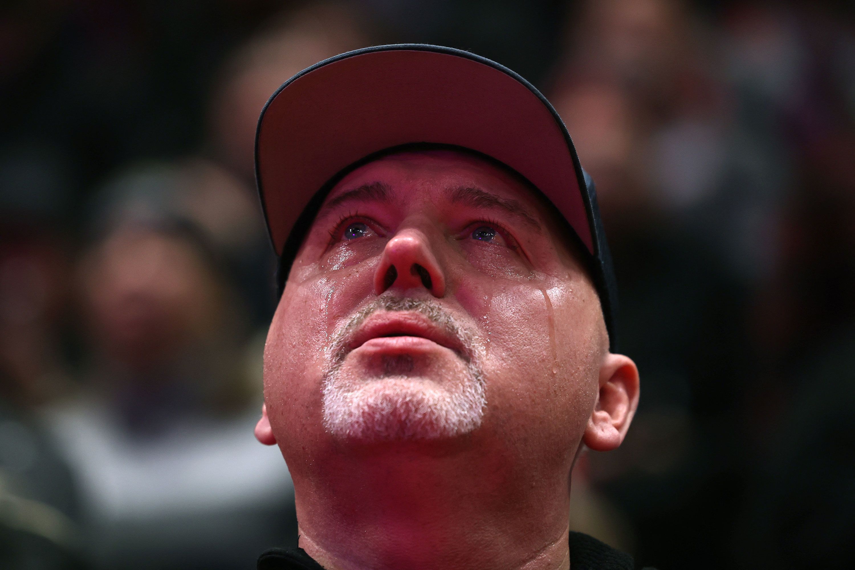 A Trump supporter cries while watching the inauguration ceremony from Capital One Arena on Monday.