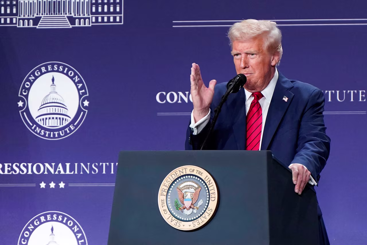 President Donald Trump gestures during a House Republican members conference meeting at Trump National Doral resort, in Miami, on Monday.