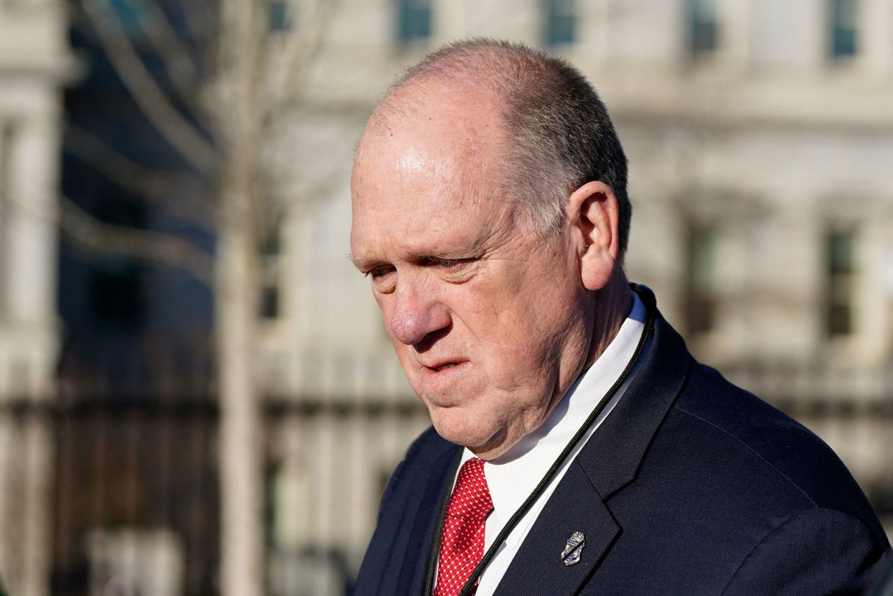 Tom Homan walks back to the White House after a television interview on Wednesday.