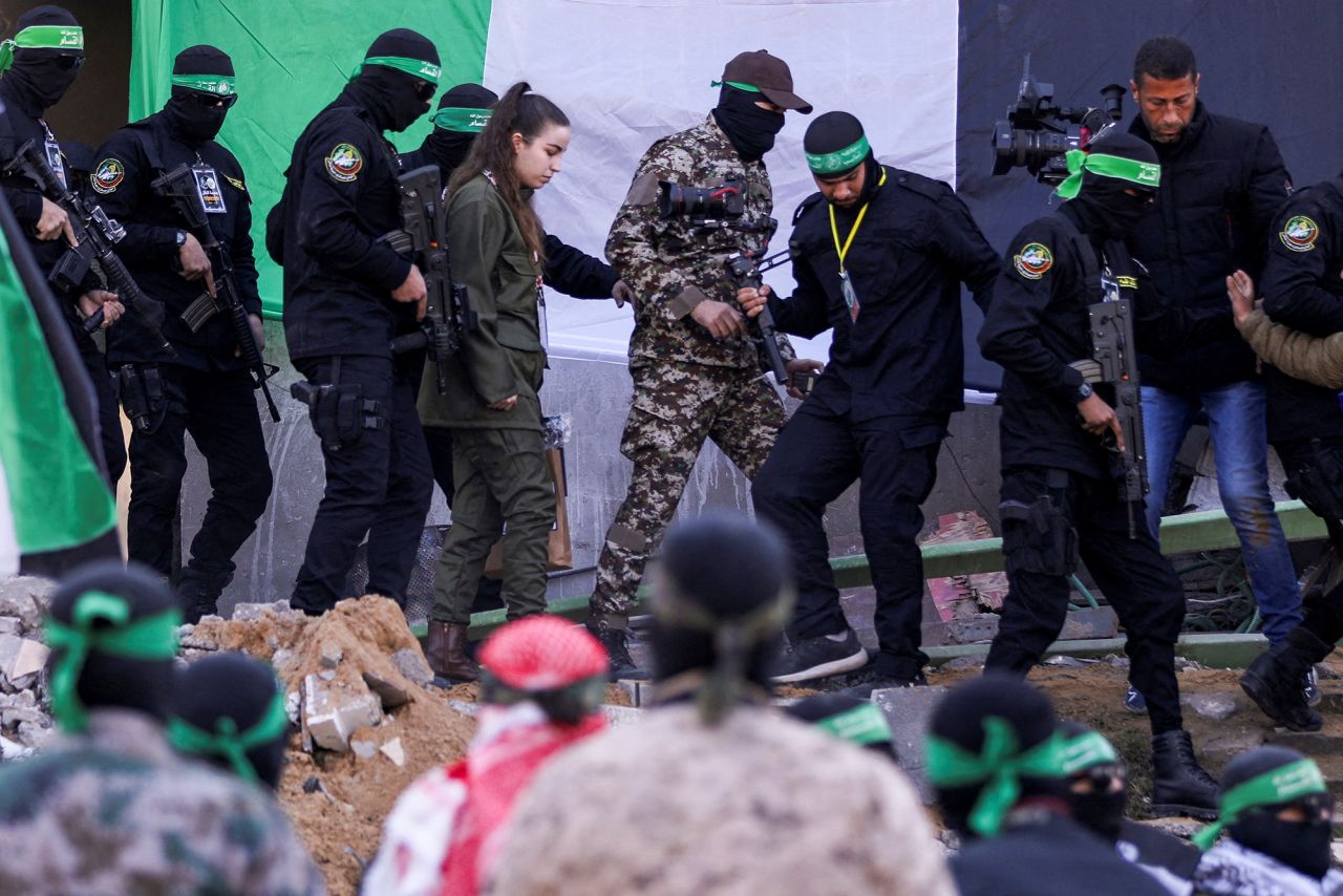 Palestinian Hamas militants release female Israeli soldier Agam Berger held in Gaza since the deadly October 7 2023 attack, as part of a ceasefire and a hostages-prisoners swap deal between Hamas and Israel, in Jabalia, in the northern Gaza Strip, January 30, 2025. REUTERS/Dawoud Abu Alkas     TPX IMAGES OF THE DAY     