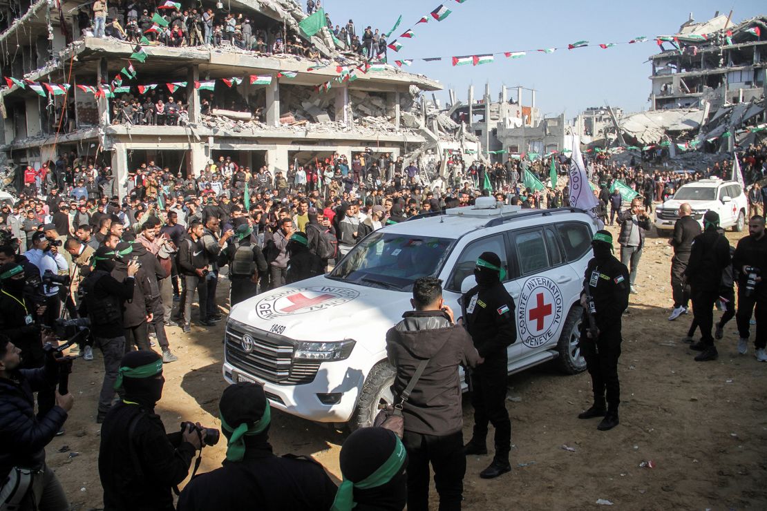 Large crowds have gathered in squares in Gaza to watch the transfer of hostages to the ICRC.