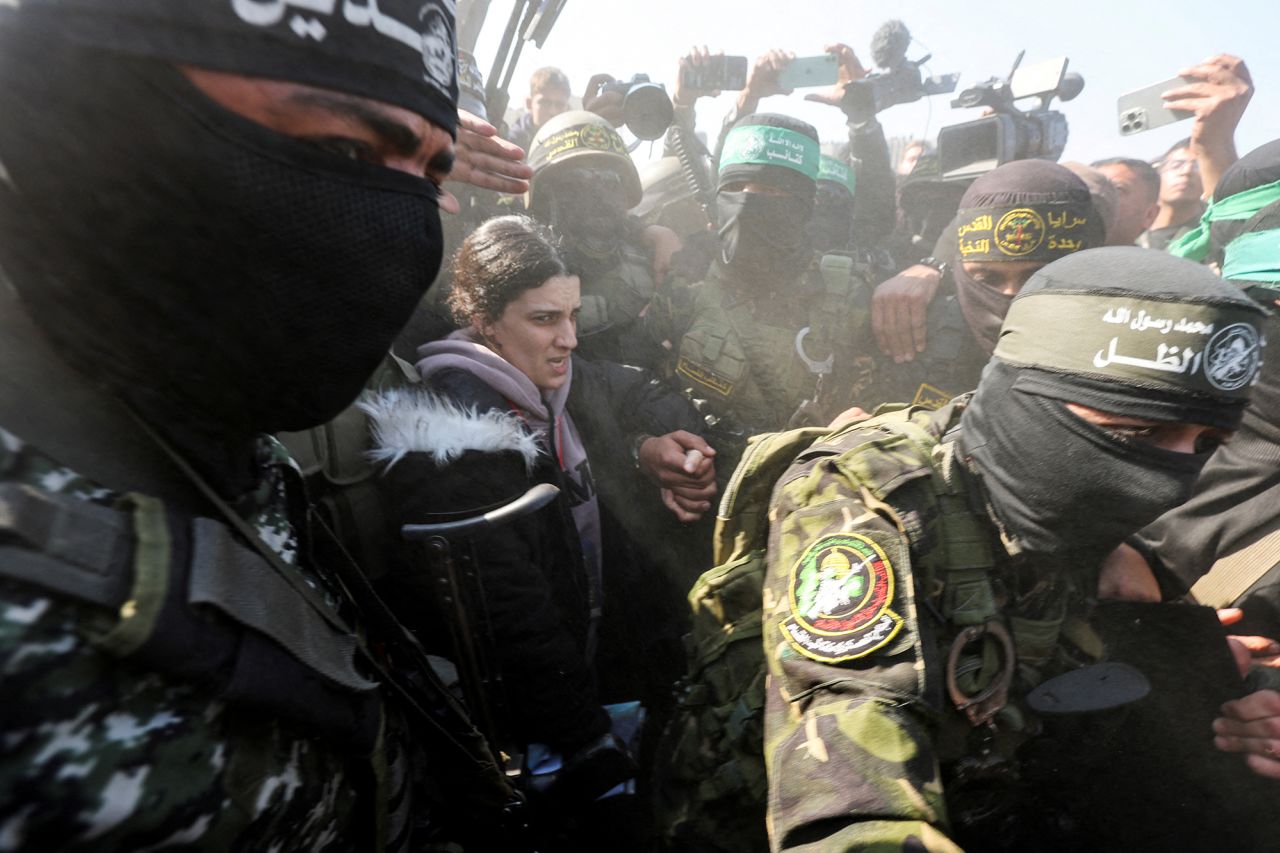 Palestinian militants surround hostage Arbel Yehoud as they hand her over to members of the International Committee of the Red Cross (ICRC) on Thursday.