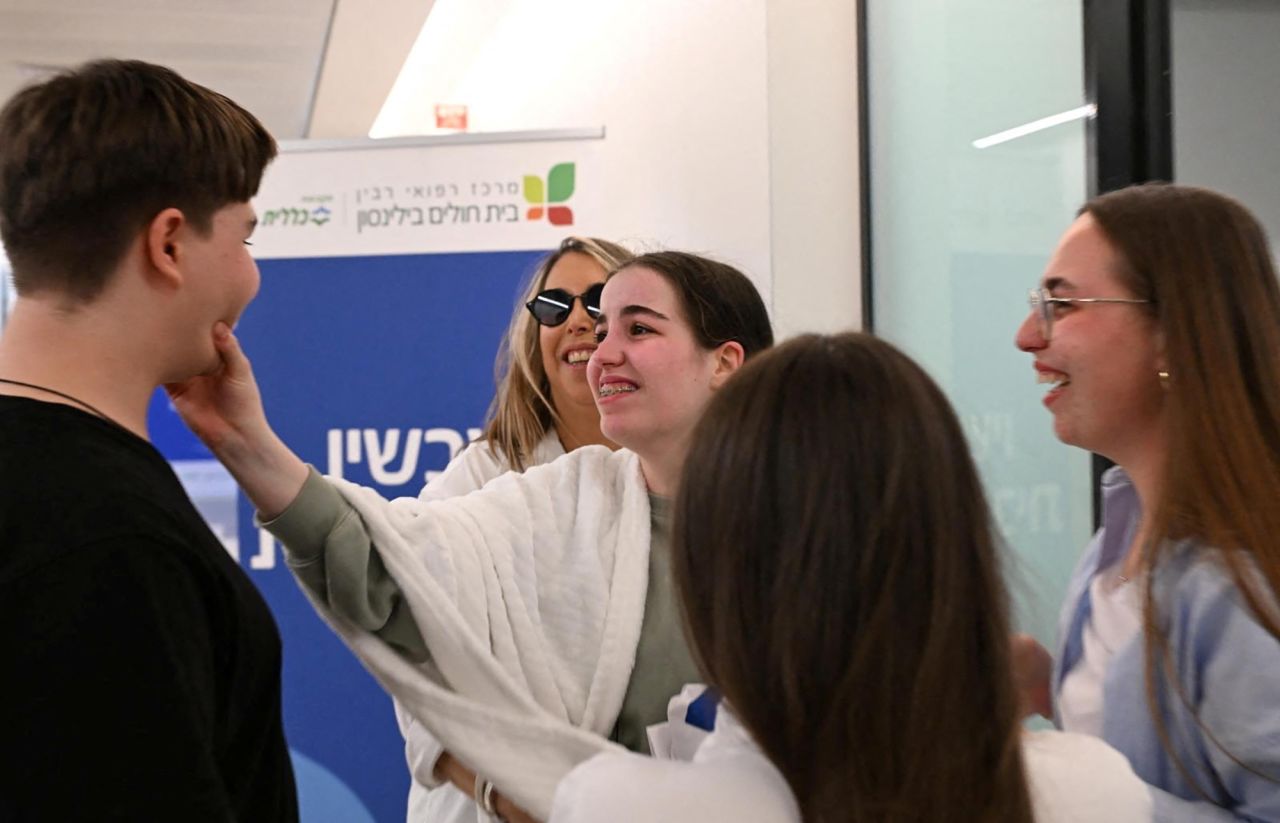Agam Berger is reunited with family members at Beilinson Schneider complex in Petah Tikva, Israel, on Thursday.