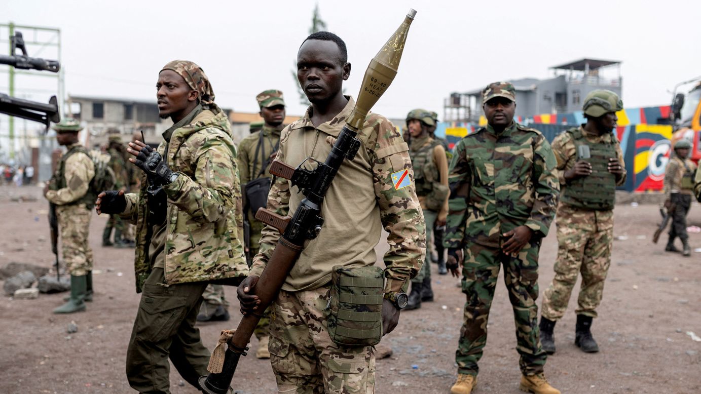 Members of the M23 rebel group gather to supervise Congolese potential recruits in Goma, eastern Democratic Republic of Congo, on January 30, 2025.