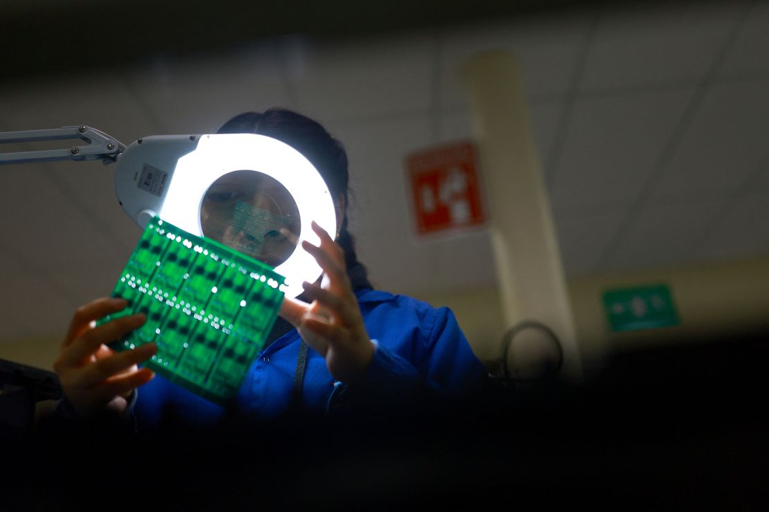 An employee works at NPD Technology, a factory that assembles printed circuit boards (PCBs) for the automotive industry and exports them to the United States, in Ciudad Juarez, Mexico.