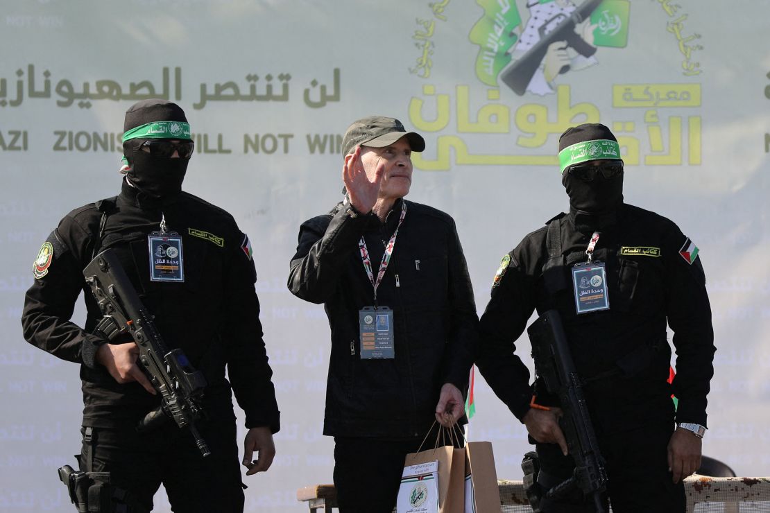 Kieth Siegel, an Israeli-American, is flanked by Hamas militants on a stage in Gaza City on Saturday.