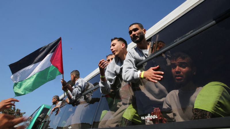 Footage shows jubilant crowds swarm bus of freed Palestinian prisoners