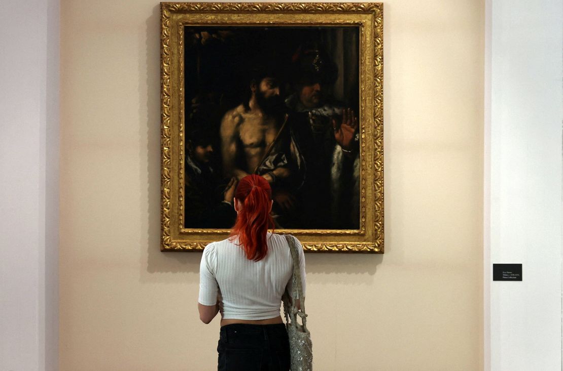 A visitor looks at Titian's "Ecce Homo" painting at the Limassol Municipal Arts Center.