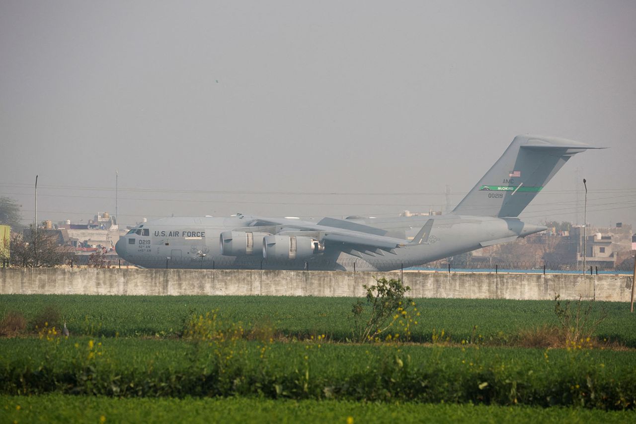 A US military plane deporting Indian immigrants lands in Amritsar, India, on Wednesday.