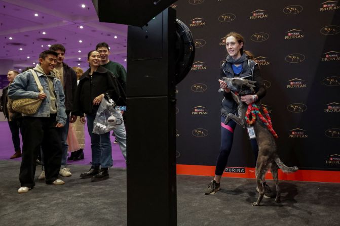 A dog owner takes a selfie with an Australian cattle dog on Saturday.