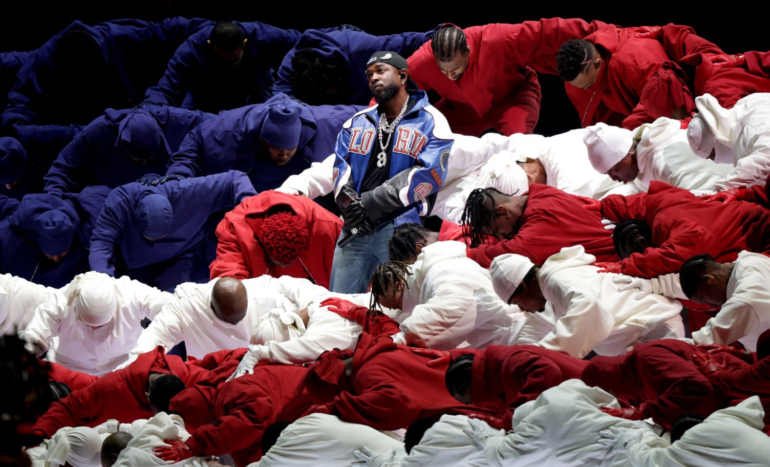 Lamar's dancers form the shape of an American flag.