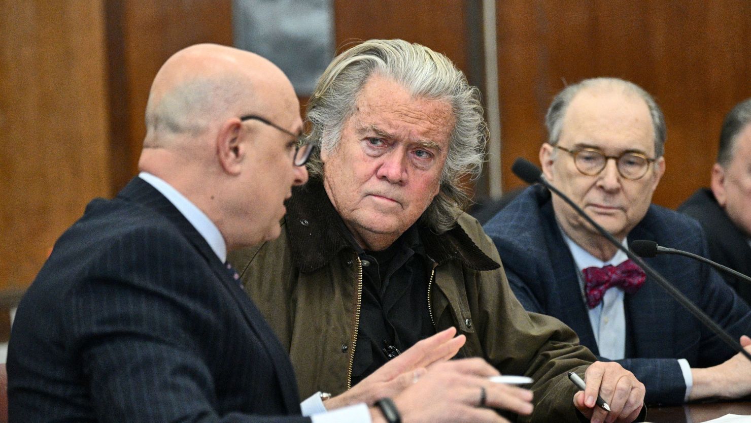 Steve Bannon, former advisor of US President Donald Trump, speaks with his lawyers during a hearing at the New York Criminal Court on February 11.