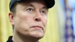 Elon Musk looks on, in the Oval Office of the White House in Washington, D.C., U.S., February 11, 2025.   REUTERS/Kevin Lamarque